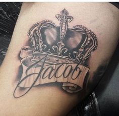 a black and white photo of a crown with the word tattoo on it