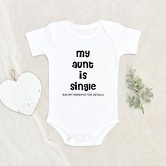 Funny Text About Aunt Baby Onesie Baby Shower Gift My Aunt is Single Baby Onesie Funny Baby Clothes Auntie Baby Onesie HOW TO ORDER:1) Choose onesie2) Select design color if applicable3) Enter customization in “Add your personalization” field4) ADD TO CART5) Select from our shipping class optionsONESIE SIZES0-3 Months :: 21-24 in. / 6-12 Ibs.3-6 Months :: 24-26 in. / 12-16 Ibs.6-9 Months :: 26-28 in. / 16-20 Ibs.12 Months :: 28-30 in. / 20-24 Ibs.PERSONALIZATIONIF the item includes personalizati Funny Onesie Ideas, Aunt Baby Onesie, White Onesie For First Birthday On Mother's Day, Mother's Day White Onesie With Letter Print, Cool Aunt Aesthetic, Funny Aunt Onesie, Baby Onsies Funny, Auntie Baby Clothes, Motherhood Aesthetic