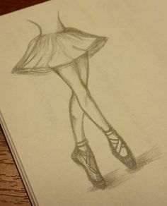 a pencil drawing of a woman's legs in high heeled shoes on a piece of paper