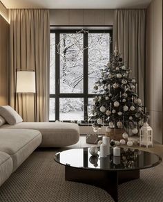 a living room filled with furniture and a christmas tree in the middle of the room