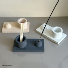 a pair of chopsticks and two cups on a table