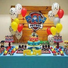 paw patrol birthday party with balloons and cake