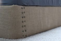 a close up view of a mattress with buttons on it