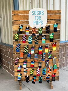 there is a sign that has socks for pops on it