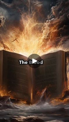 an open book with the words the blood on it in front of a fire and water scene