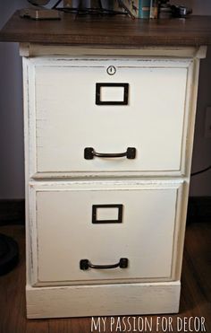 an old dresser with two drawers is painted white