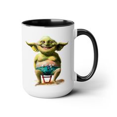 a coffee mug with an image of yoda on it