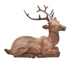 a statue of a deer laying down with antlers on it's head