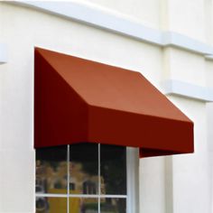 a red awning on the side of a building