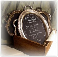 a menu in a wooden box on a table