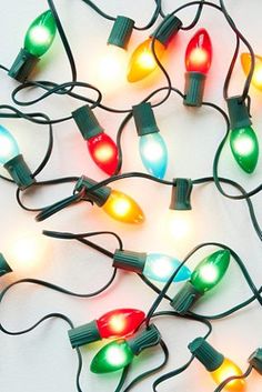 a bunch of christmas lights that are laying on the ground with some wires attached to them