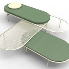 two tables with green and white covers on each one, sitting next to each other