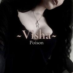 a woman wearing a black shirt with the words visha poison written on it