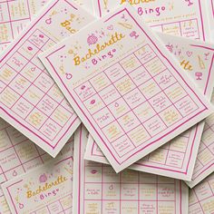 a pile of pink and yellow printable baby shower games on top of each other