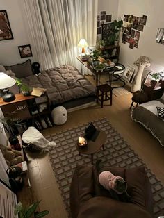 an aerial view of a living room with couches, coffee table and other furniture