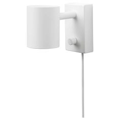 a white wall mounted light with a plug attached to it's side and a lamp shade on the other side