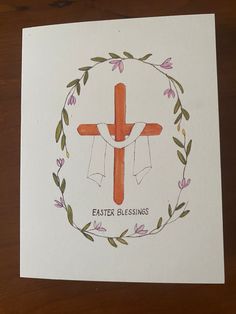 an easter card with a cross and wreath around it