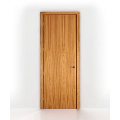 an open wooden door on a white wall