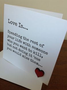 a card with a red heart on it that says love is spending the rest of your life with someone who you want to kill?