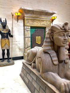 statues of egyptian gods and pharaohs in a museum