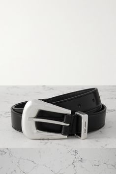 SAINT LAURENT's belt is punctured with a polished silver-tone buckle and tip that lend a decidedly Western feel. It's been crafted in Italy from smooth leather and engraved with the house's moniker at the loop. Dream Wishlist, Designer Hair Accessories, Sports Trousers, Raffia Bag, Western Belts, Ballet Pumps, The Loop, Ski Wear, Black Belt