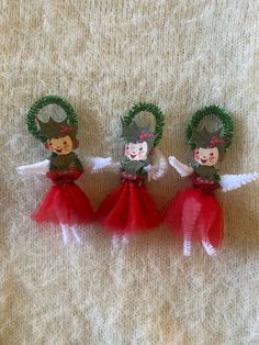 three little christmas angels with wreaths on their heads