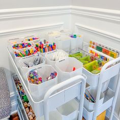 the inside of a refrigerator filled with lots of crafting supplies and storage bins