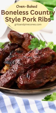 oven - baked boneless country style pork ribs on a plate with parsley garnish