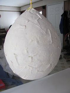 a large paper mache hanging from the ceiling