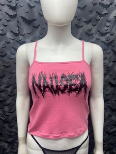 This is a pink Nausea crop tank top with spaghetti straps. This has a Nausea image screen printed on the front. 57% cotton/ 38% polyester/ 5% Spandex These are handmade screenprinted and slightly vary from the photo. Please feel free to email me any questions. Thanks for looking. I do not do exchanges and I do not take returns unless the item is damaged. I thoroughly check each item before it is shipped out. The seller is not responsible for any lost or stolen packages. Trendy Cotton Tank Top For Festivals, Trendy Cotton Festival Tank Top, Graphic Print Tank Top For Spring Concerts, Graphic Print Tank Top For Concerts In Spring, Pink Punk Top For Alternative Fashion, Y2k Style Cotton Tank Top For Festivals, Grunge Graphic Print Tank Top For Summer, Summer Grunge Graphic Print Tank Top, Cotton Tank Top For Spring Music Festival