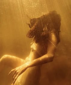 a woman is underwater in the water