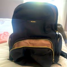 Like New Gently Used Tumi Backpack. There Is A Spot Inside That Is In The Photo But Can Be Removed. Serial Number Is There To Check Authenticity. Love It But Had To Buy Bigger! Gold Standard Backpack For Travel, Gold Travel Backpack With Adjustable Strap, Gold Backpack With Adjustable Strap For Travel, Gold Backpack For Travel, Tumi Backpack, Tumi Bags, The Photo, Love It, Like New