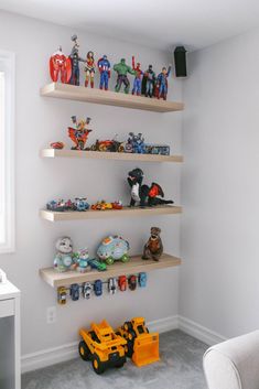 a room with shelves filled with toy cars and toys