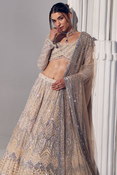 Featuring an ivory lehenga in net and silk base with embroidery. It is paired with a blouse and a net dupatta. Accentuate it with statement jewellery and heels for a wedding or engagement ceremony.Last few days left the Wedding Carnival ends in up to 70% off shop now.  #Perniaspopupshop #womenswear #ethnic #whatiworewastrending #ppuslove #lehengaset #prewedding #net #silk #weddingwear #engagement #embroideredlehenga #bridallook Wedding Carnival, Vintage Prom Dresses, Lehenga Top, Bridesmaid Lehenga, Big Size Dress, Lavender Nails