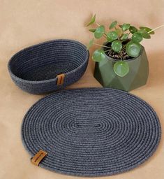 two round rugs next to a potted plant