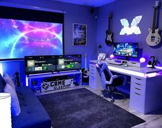 a living room filled with furniture and a flat screen tv next to a guitar wall