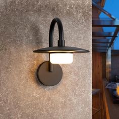 an outdoor wall light on the side of a building