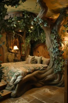 a large bed sitting under a tree in a bedroom