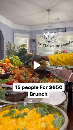 a man standing in front of a buffet filled with lots of food