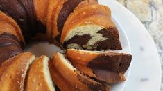 a bundt cake with slices cut out on a plate