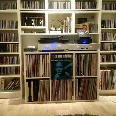 an entertainment center filled with lots of records