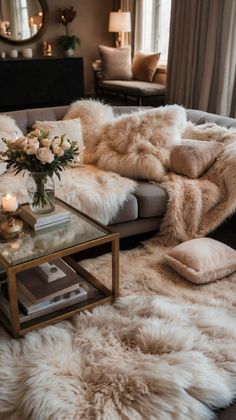 a living room filled with furniture covered in fur