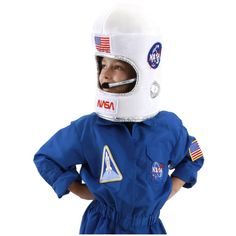 a young boy wearing an astronaut suit and helmet