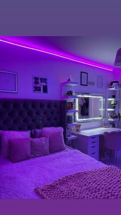 a bedroom with purple lighting in the ceiling