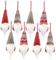 six christmas gnome ornaments hanging from red and white string with polka doted hats on them