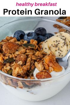 a bowl filled with granola and blueberries next to yogurt, nuts and fruit