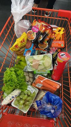 a shopping cart filled with lots of food