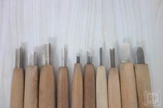 seven woodworking tools lined up in a row