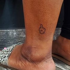 a person with a tattoo on their foot