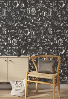 a chair sitting in front of a chalkboard wall with coffee related drawings on it